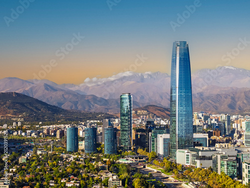 Panoramic view of the Santiago city skyline with skyscraper and the Andes mountains in the background, Chile
