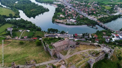 Aerial view of Rozafa Castle ruins perched on a rocky hill overlooking the winding rivers and city of Shkodër, Albania travel destination in Balkans Europe 