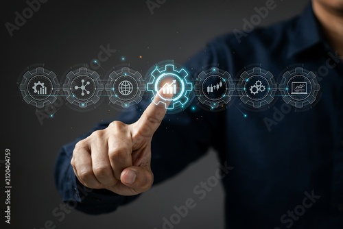 Businessman touching digital interface with business growth icons and data analytics strategy