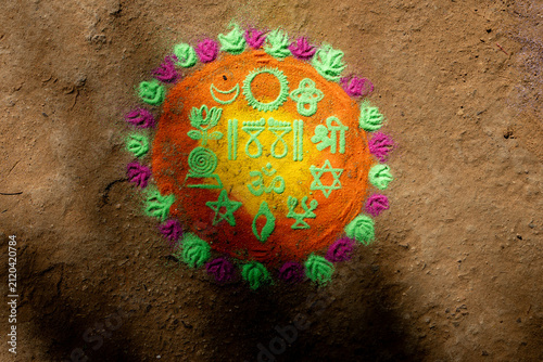 Traditional Indian Rangoli Decoration Featuring Floral Motifs And Geometric Pattern