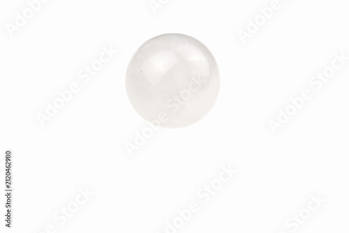 A white stone ball, a souvenir on a white background