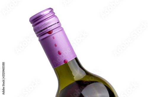 Wine Bottle With Purple Screwcap Top And Red Wine Drops isolated on a white background