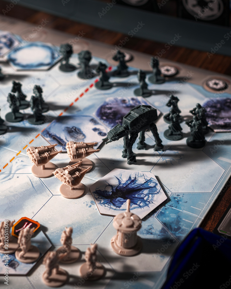 Fototapeta premium AT AT walkers advancing against Rebel forces during the Battle of Hoth on a detailed tabletop battlefield with defensive towers