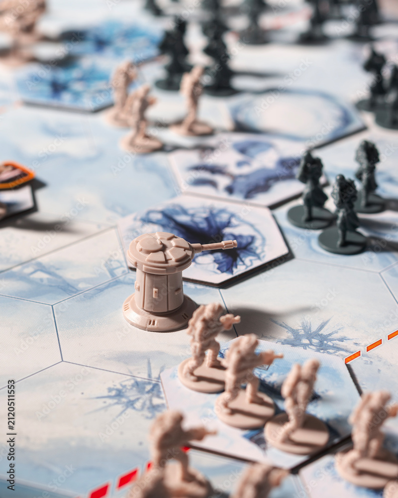 Fototapeta premium Rebel defense tower surrounded by infantry on a Battle of Hoth tabletop battlefield with dramatic lighting as Imperial forces advance across the snowy terrain in a cinematic perspective
