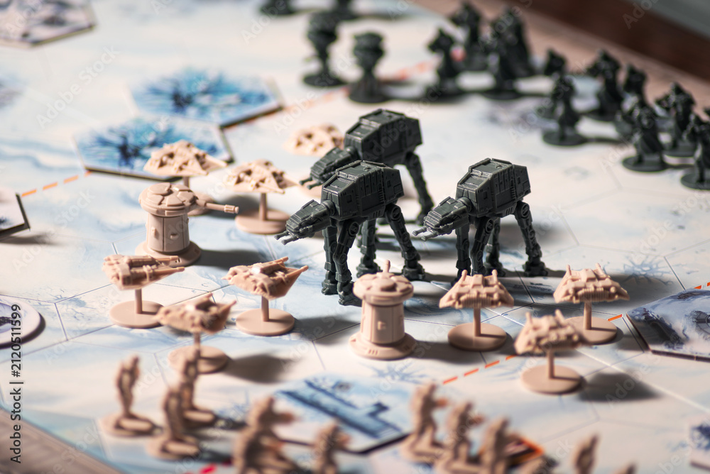 Fototapeta premium AT AT walkers advancing against Rebel forces during the Battle of Hoth on a detailed tabletop battlefield with defensive towers