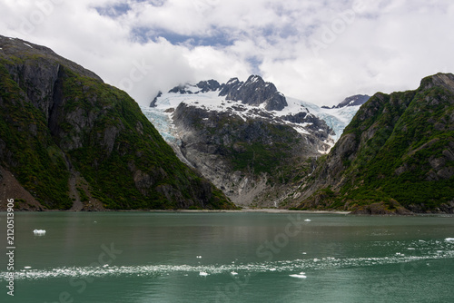 Holgate Glacier tidewater glacier valley framing ice fields under cloud covered peaks in Kenai Fjords National Park Alaska USA