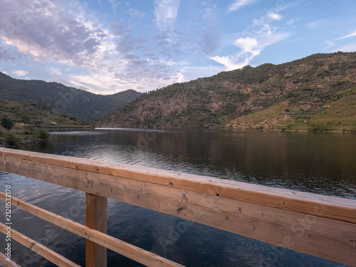 Trail waymarkers guiding hikers along the Sao Mamede de Ribatua route in Alijo, Portugal. Scenic boardwalks and gravel paths near the Tua River in the Douro Valley.