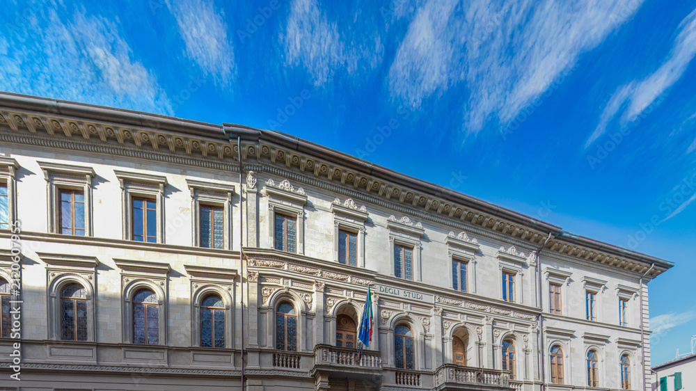 Fototapeta premium Exterior facade of Palazzo della Sapienza in Pisa, showcasing its historic architecture