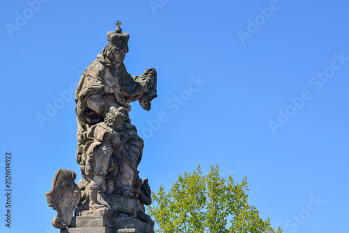 Saint Ludmila stone statue at Charles bridge in Prague