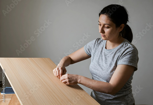Woman assembling flat pack ...
