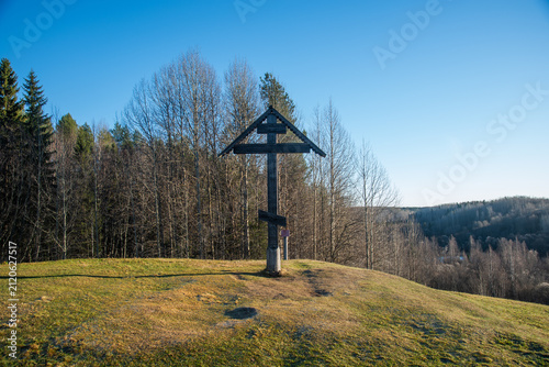 Wooden orthodox cross landscape under clear blue sky