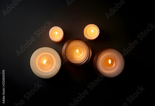 Five lit candles with warm ...
