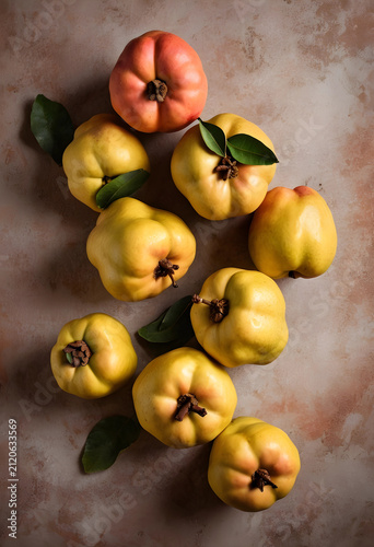 Fresh ripe quinces with gre...
