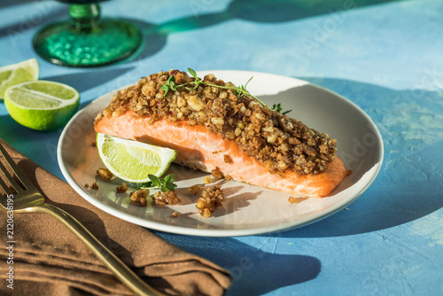 Baked salmon with lemon bread crust and fresh vegetable salad