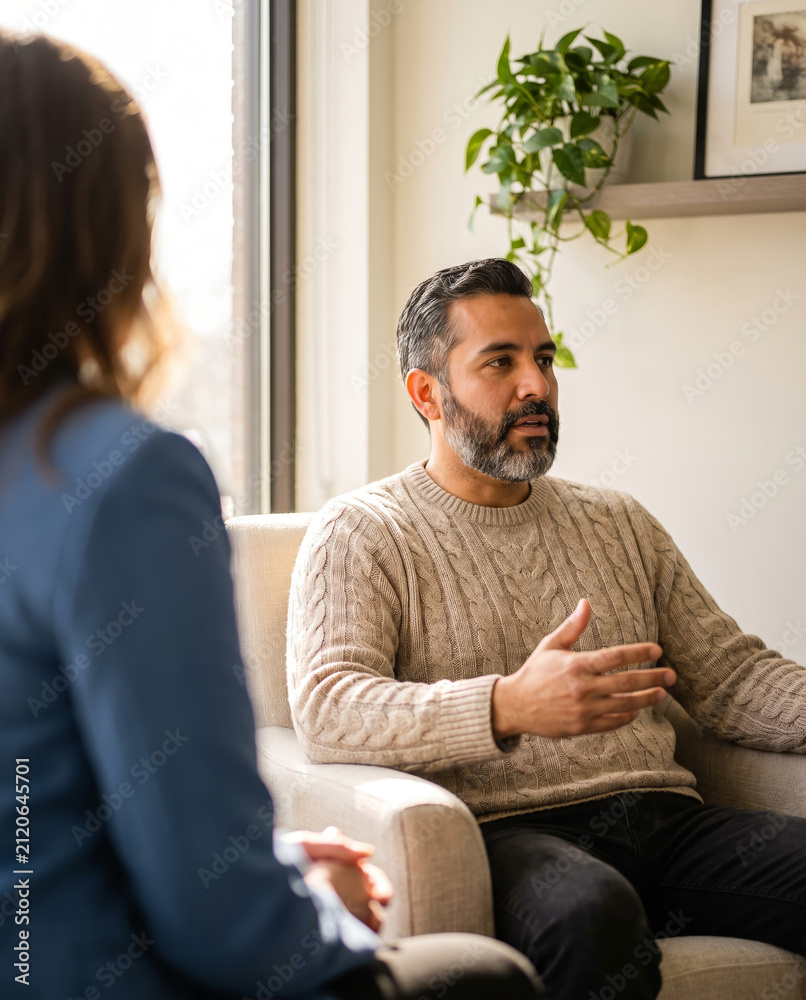 Fototapeta premium Calm man sharing his thoughts during a supportive therapy session