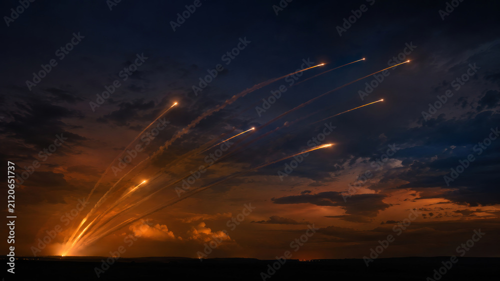 Obraz premium Multiple Missile Launches Across Night Sky During Military Attack