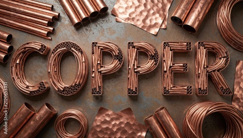 Flat lay word copper spelled capital letters made arranged way form background dark grey color textured surfac