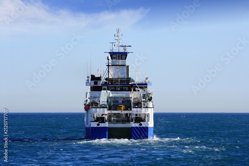 Obraz na plátně Trauler fishing boat sailing along the Mediterranean coast of Spain