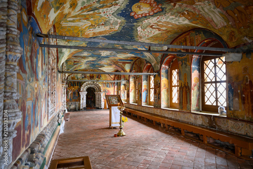 The interior of the 17th century Church of the Nativity of Christ with religious paintings and texts in Tutaev, Russia