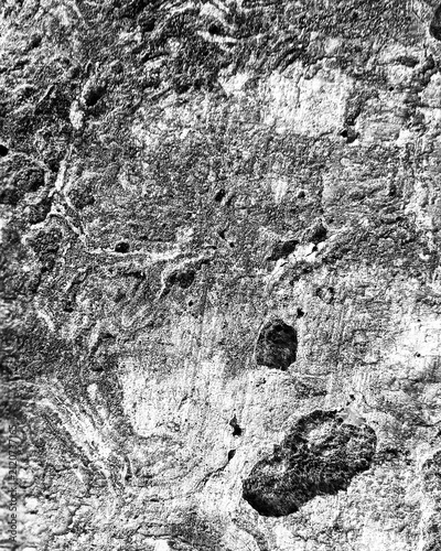 High contrast black and white rough concrete texture background with distressed weathered wall surface.