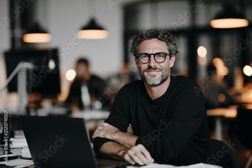 Confident Young Businessman Working in Modern Luxury Office