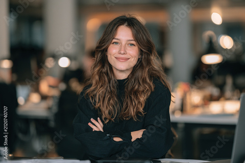 Young Female University Student Sitting in Modern Classroom