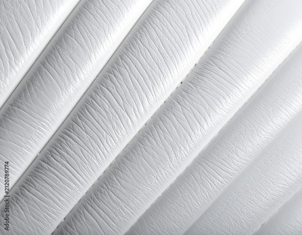 Naklejka premium Close-up of White Padded Leather Texture with Diagonal Ribbing