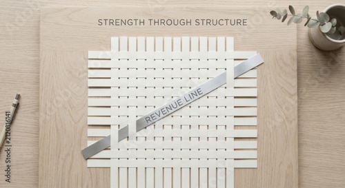 Woven Paper Strips Form a Grid Structure with 'Revenue Line' Text