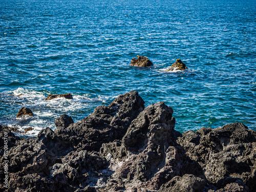 Volcanic Basalt Rocks Along the Coast of Jeju City, Jeju Island, South Korea