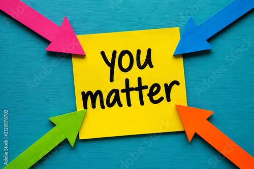 Motivational concept with you matter message written on yellow sticky note.