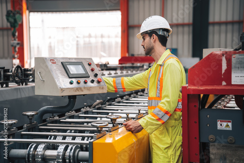 Industrial Technician Operating Machinery in Steel Manufacturing Plant