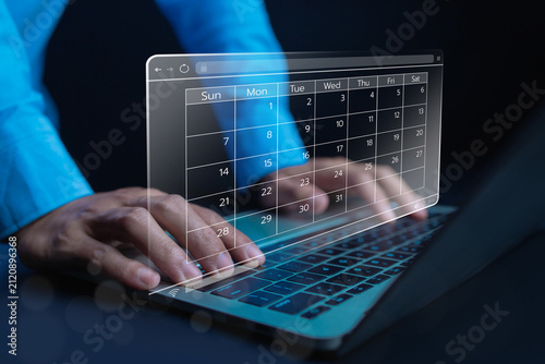 Digital calendar interface on laptop for online scheduling, appointment management, business planning, time organization, workflow optimization, productivity, and smart office technology in a modern.