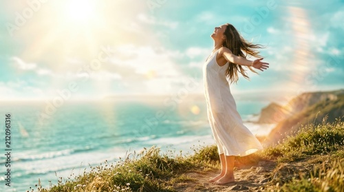 Free Happy Woman Enjoying Nature. Beauty Girl Outdoor. Freedom concept. Beauty Girl over Sky and Sun. Sunbeams. Enjoyment