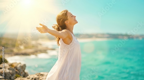 Free Happy Woman Enjoying Nature. Beauty Girl Outdoor. Freedom concept. Beauty Girl over Sky and Sun. Sunbeams. Enjoyment