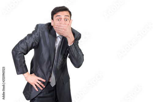 Obraz na plátně Talkative man in suit covering mouth with hand