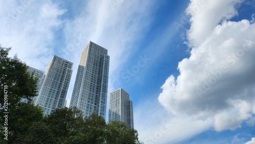 Modern Residential Towers Against Blue Sky and Dramatic Clouds