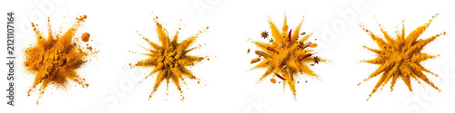 Turmeric and spices powder explosion set isolated on black background