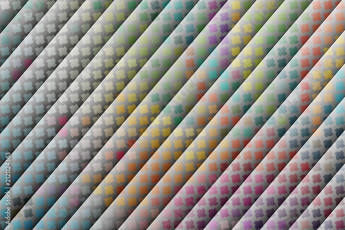 An abstract 3D pattern of diagonal cylinder tubes shaded in grey gradient metallic tones, overlaid with tiny pastel multi-colored floral star motifs.
