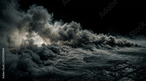 A thick layer of dramatic white fog and smoke spreading low across dark rocky ground