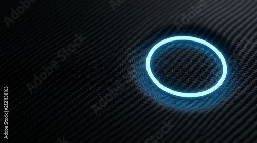 Glowing cyan neon circle light ring on a dark black carbon fiber textured surface with a subtle circular indentation in the background