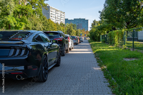 Cars Parked Along Residential Street Near Apartment Buildings Urban Parking Infrastructure