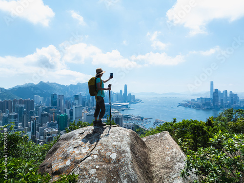 Photography Woman hiking on mountain top in Hong Kong