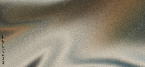Muted beige brown and blue flowing fabric folds on dark grainy background with soft blurred waves and sophisticated abstract texture