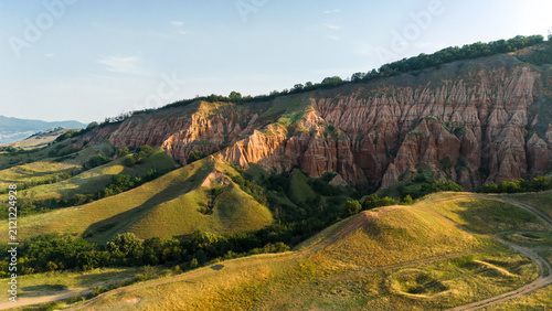 Red Clay Cliffs and Green Hills at Rapa Rosie