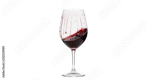 фотографія Red wine swirling in a clear glass with droplets on the side