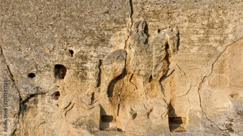 Close up aerial view of the Madara Rider rock relief cut into a high cliff wall in Bulgaria, a medieval UNESCO World Heritage site and ancient monument