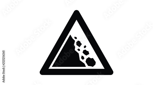 Falling rocks warning sign alerts drivers to potential hazards on the mountainous road.