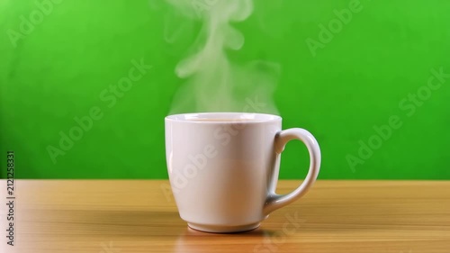 close-up time-lapse of white ceramic vase on wooden surface