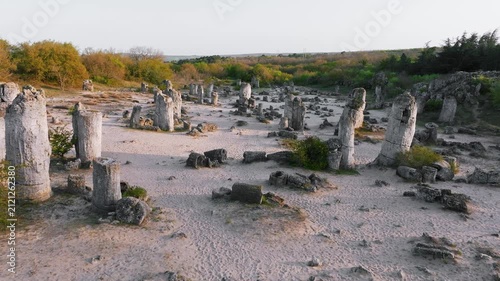 Pobiti Kamani Stone Forest natural rock pillars aerial drone view sand desert landscape Varna Bulgaria tourist landmark summer sunset light travel destination