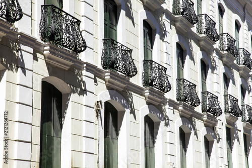 Elegant European Building Façade with Ornate Wrought Iron Balconies